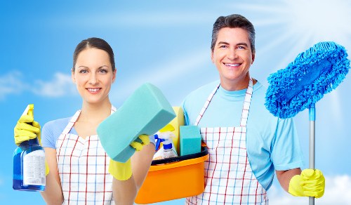 Carpet cleaners assessing a customer issue carefully