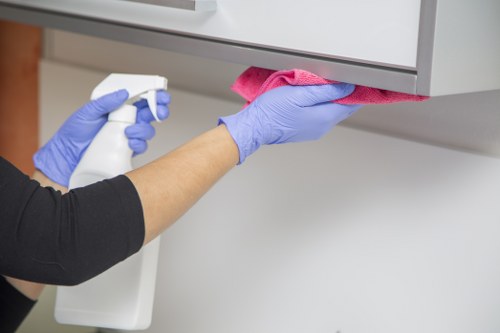 Protective gloves and PPE used during carpet cleaning in Sipson